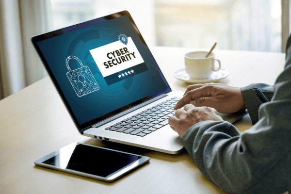 Cyber-Security-Tips-Small-Business Cashier with an outdated cash register rather than a new POS system.