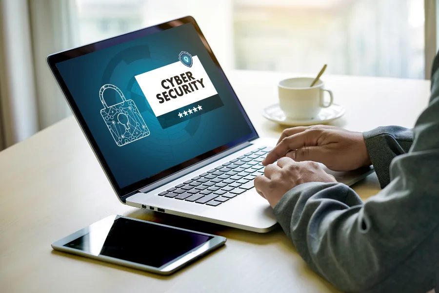 Cashier with an outdated cash register rather than a new POS system.