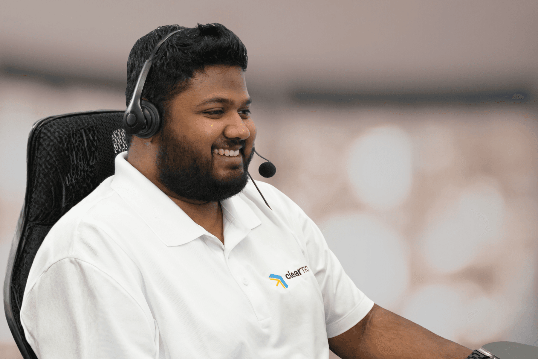 ClearTEQ technical services specialist wearing a headset and helping customers remotely.